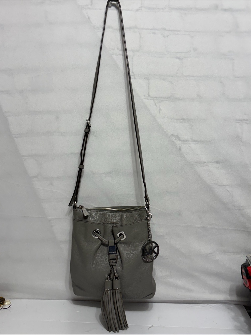 Michael Kors Gray Leather Tassel Drawstring Crossbody Bag
